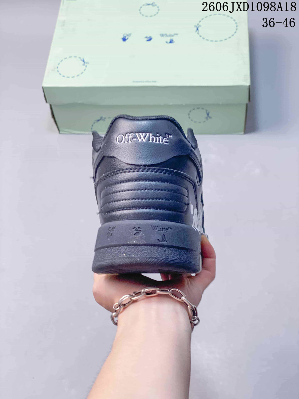 Rear view of the sneaker showing heel branding and layered sole
