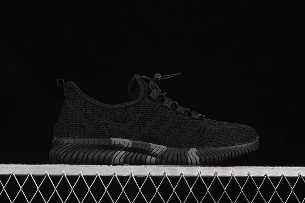 Side profile showing the black upper and sculpted sole