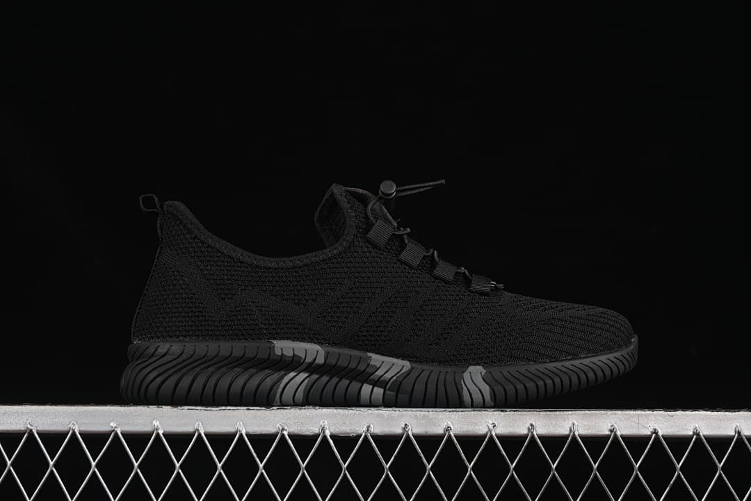 Side profile showing the black upper and sculpted sole