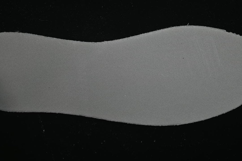 Close-up view of the pale, contoured midsole component