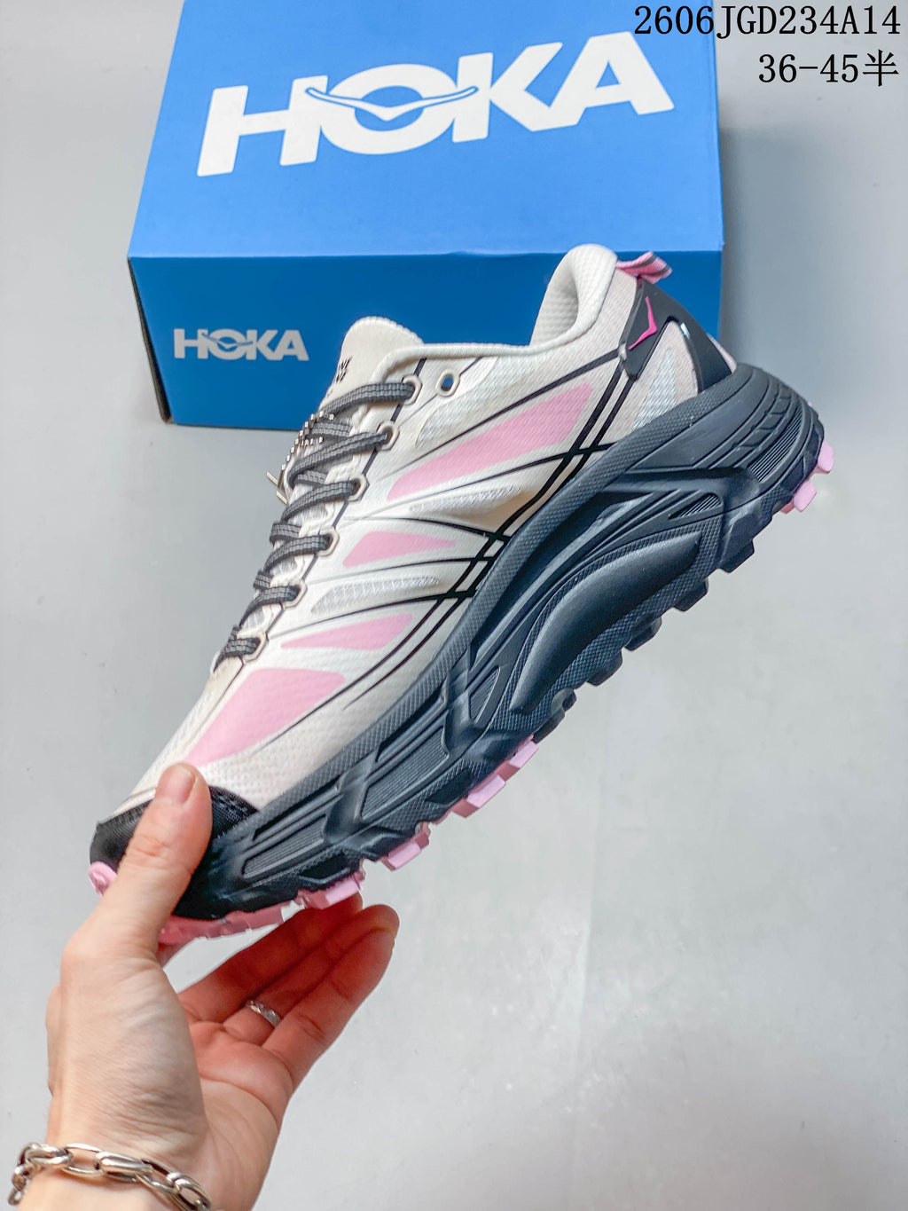 Side view of the HOKA Mafate Speed 2 Low with pink accents and a dark gray sole