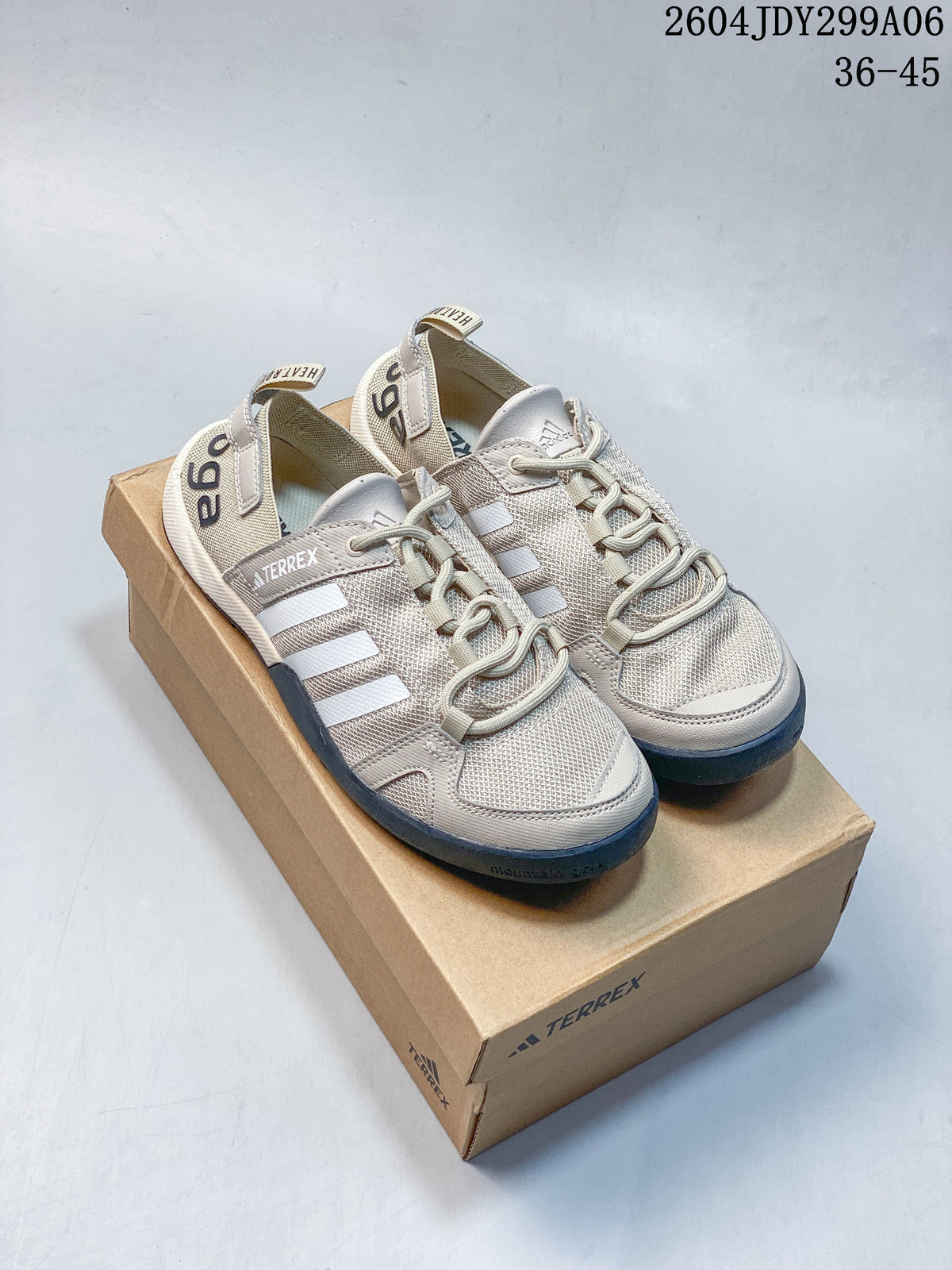 Pair of light beige Adidas Terrex lace-up shoes on a branded box; image overlay reads 36–45.