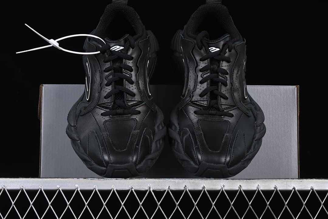Front view of the pair of black lace-up sneakers