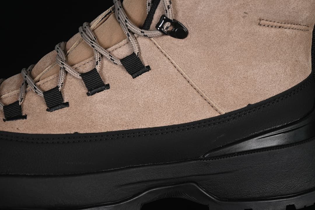Close-up of side panels, lace loops, laces, and black overlay