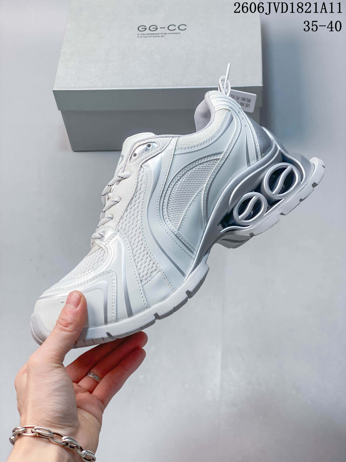 Side view highlighting mesh panels and the chunky sculpted sole
