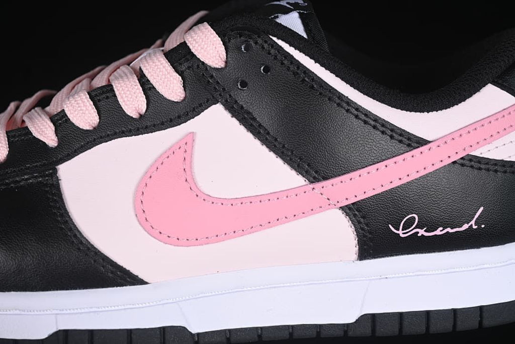 Close-up of the pink side Swoosh and black and pale pink upper
