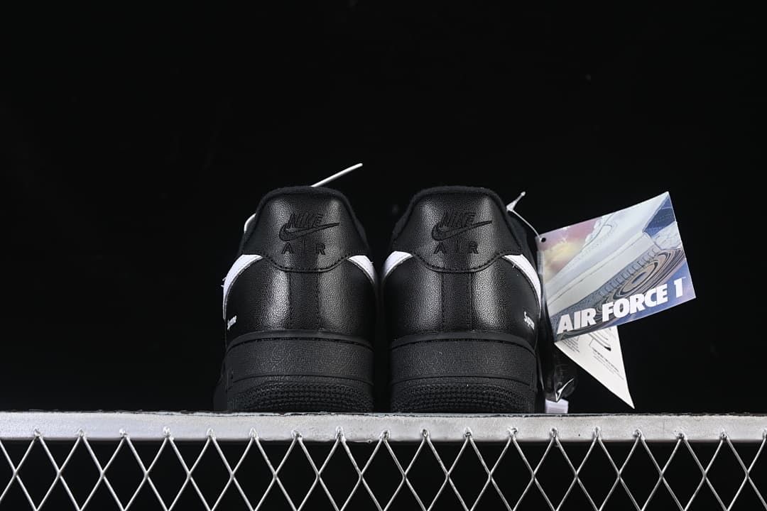 Rear view of the pair with Nike Air heel tabs and attached product card
