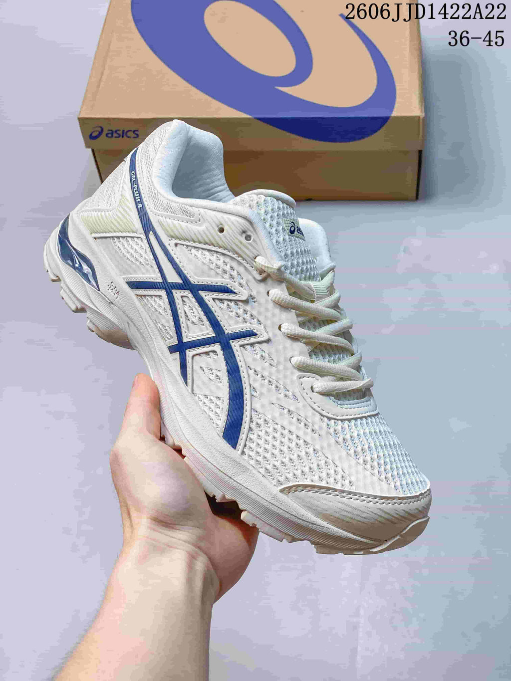 Angled side view of a white ASICS GEL-FLUX shoe with blue accents