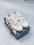 Light gray and off-white adidas Urban Reverie low-top sneakers with crossover straps and gum-colored soles