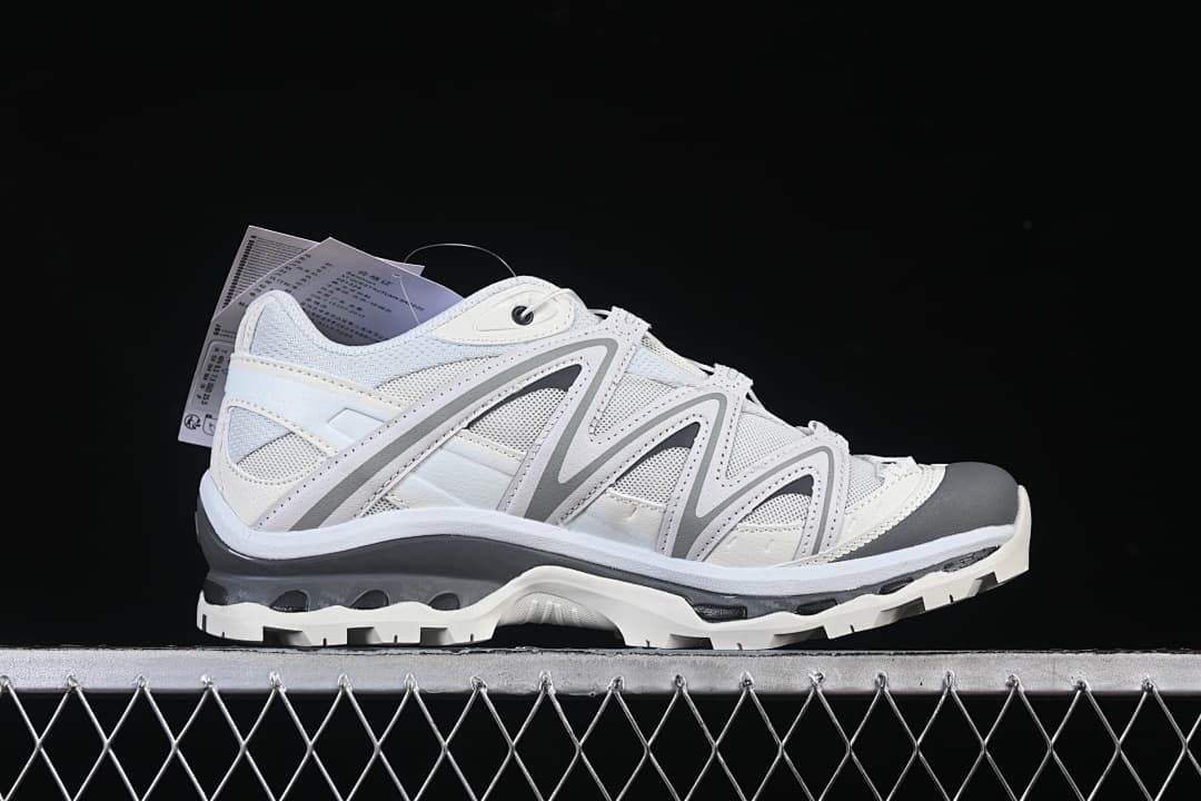 Outer side profile of a white and grey Salomon XT-Quest shoe