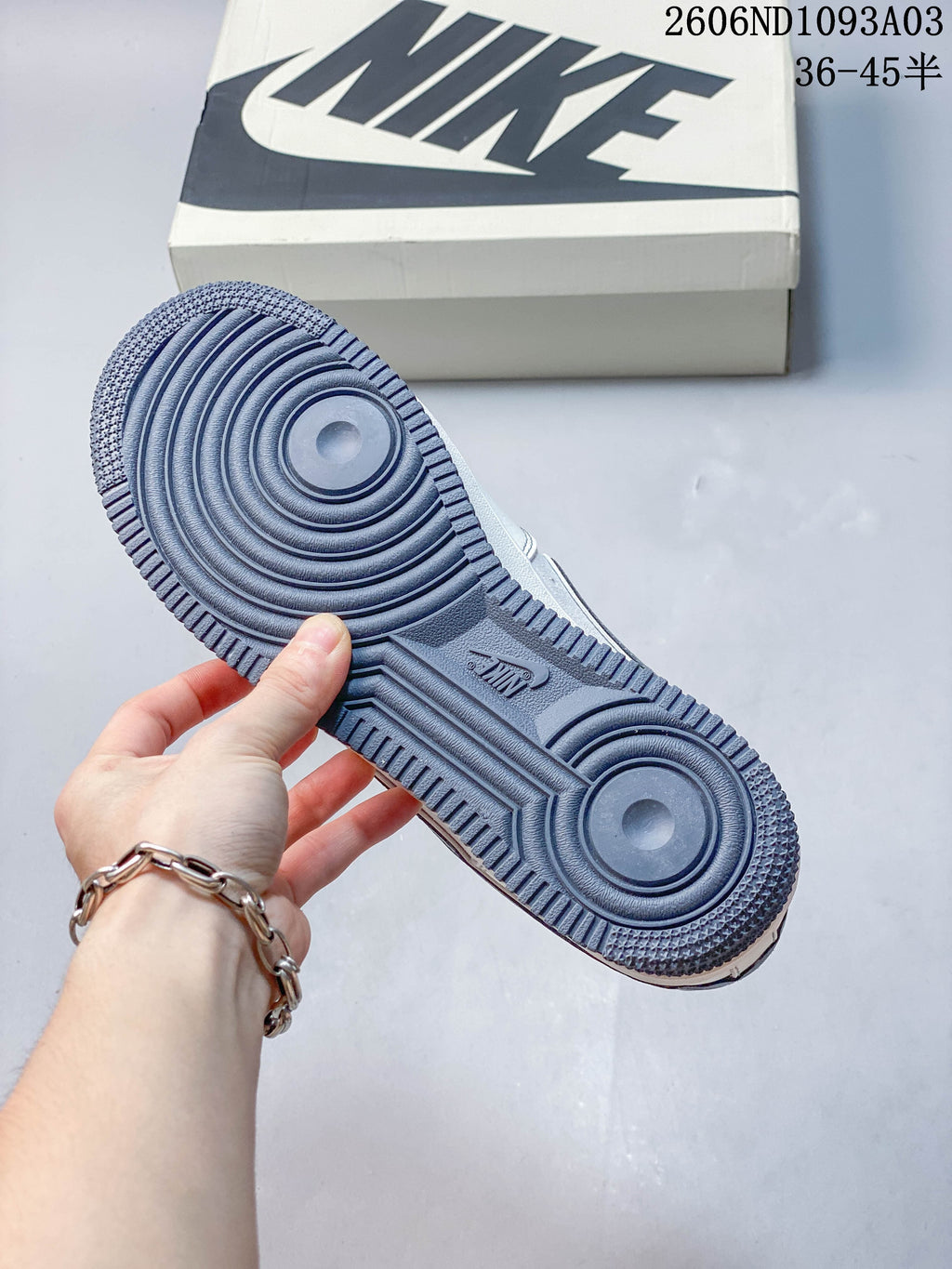 Close-up of the grey patterned outsole on a Nike Air Force 1 '07 Low sneaker