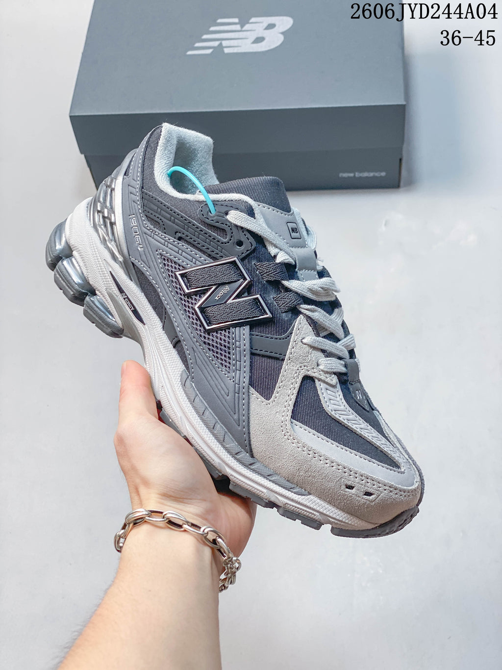 Side view of a gray-toned New Balance 1906R sneaker
