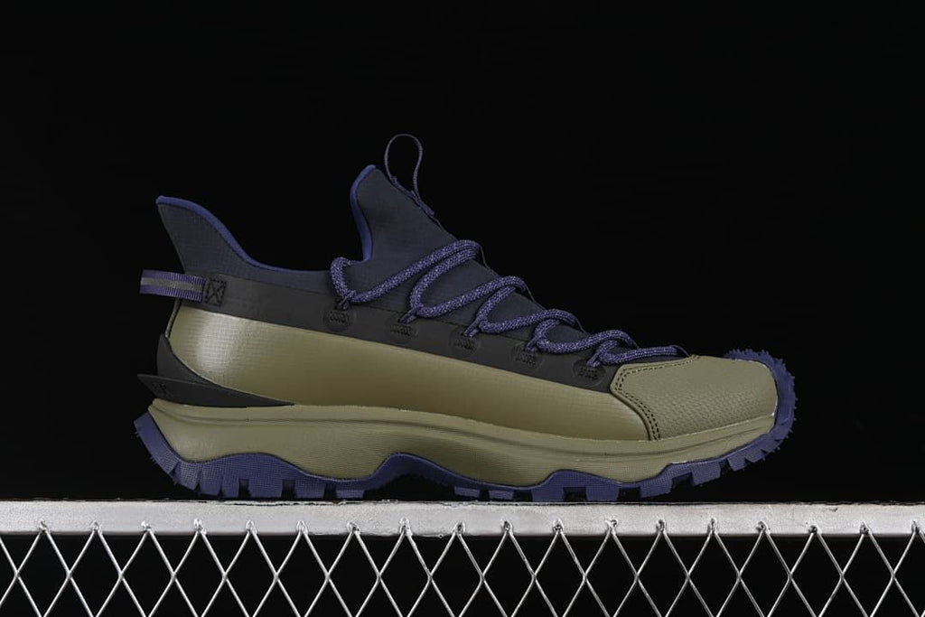 Side profile showing the shoe's layered upper and chunky outsole
