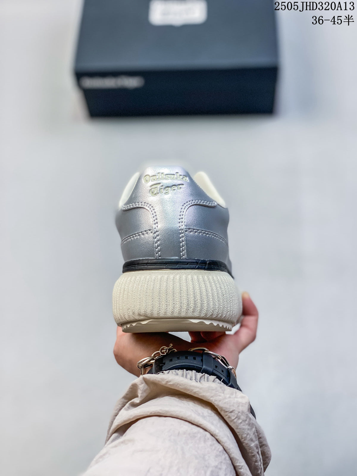 Rear view showing the silver heel and ribbed cream-colored sole