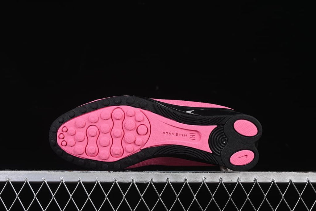 Underside view showing pink and black outsole details