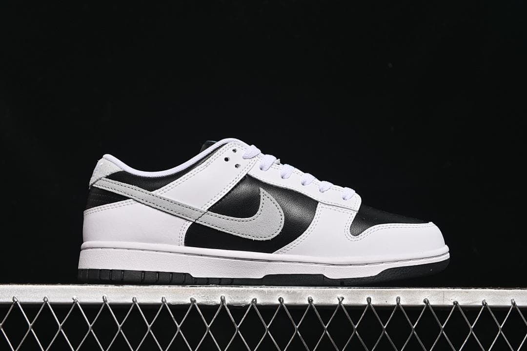 Side profile of a black, white, and grey low-top sneaker