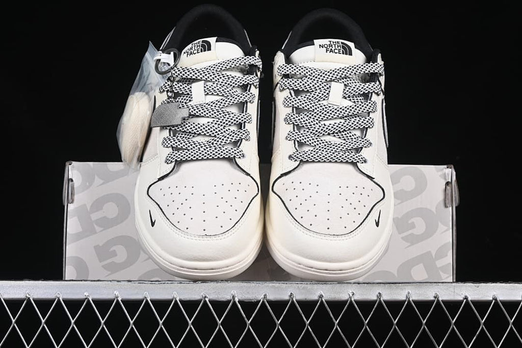 Front view of the pair showing perforated toes and patterned laces