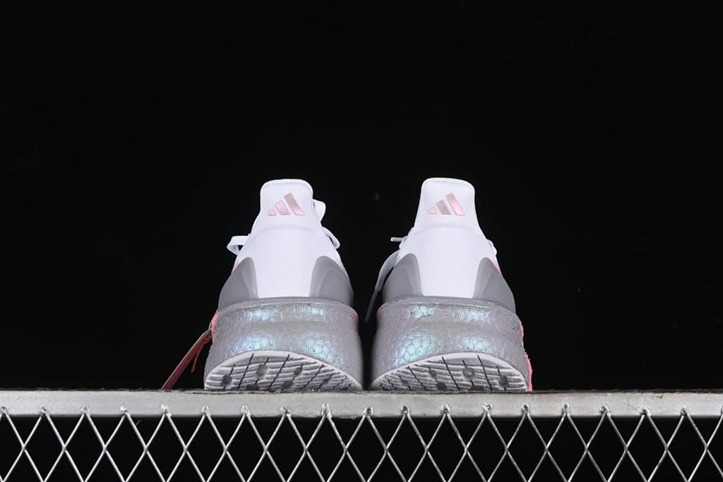 Rear view of both shoes and their outsoles