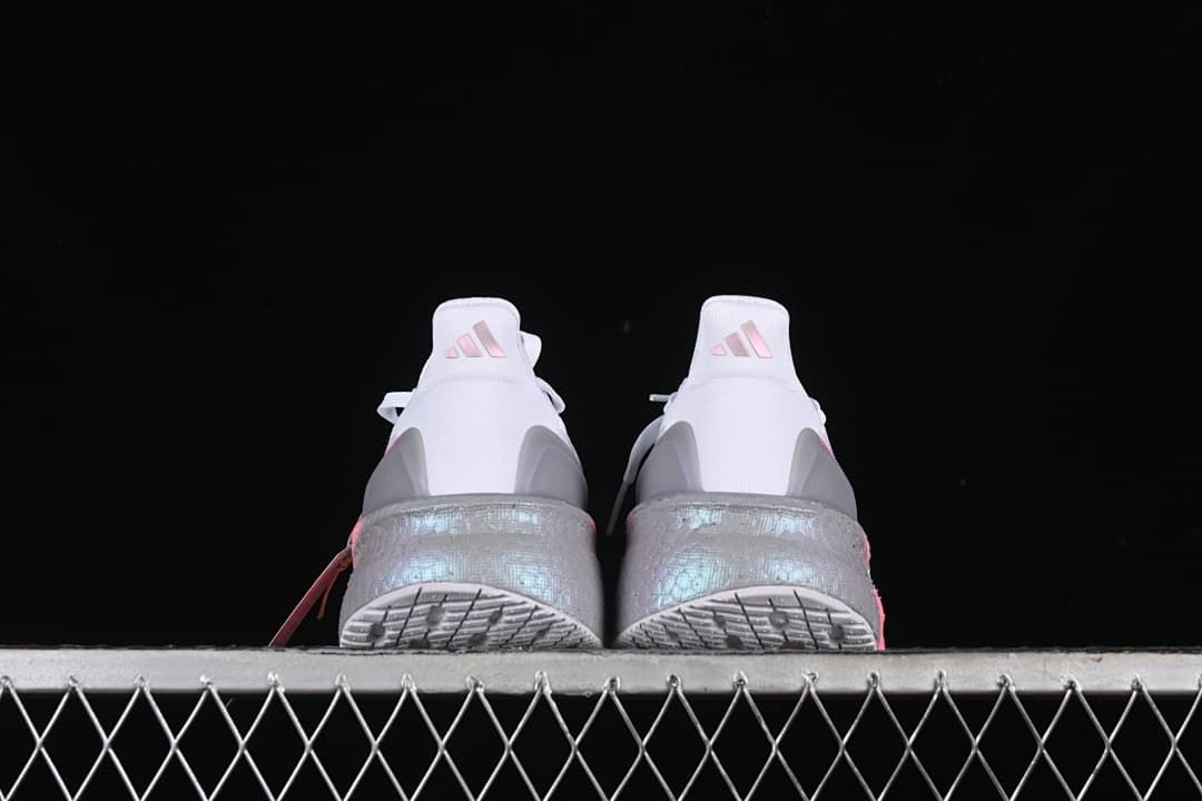 Rear view of both shoes and their outsoles