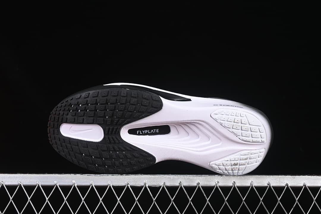 Bottom view showing the patterned outsole and central plate marking