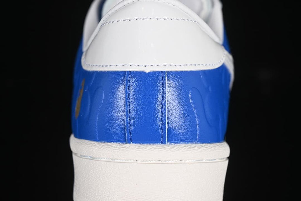 Close-up of blue heel and white heel tab