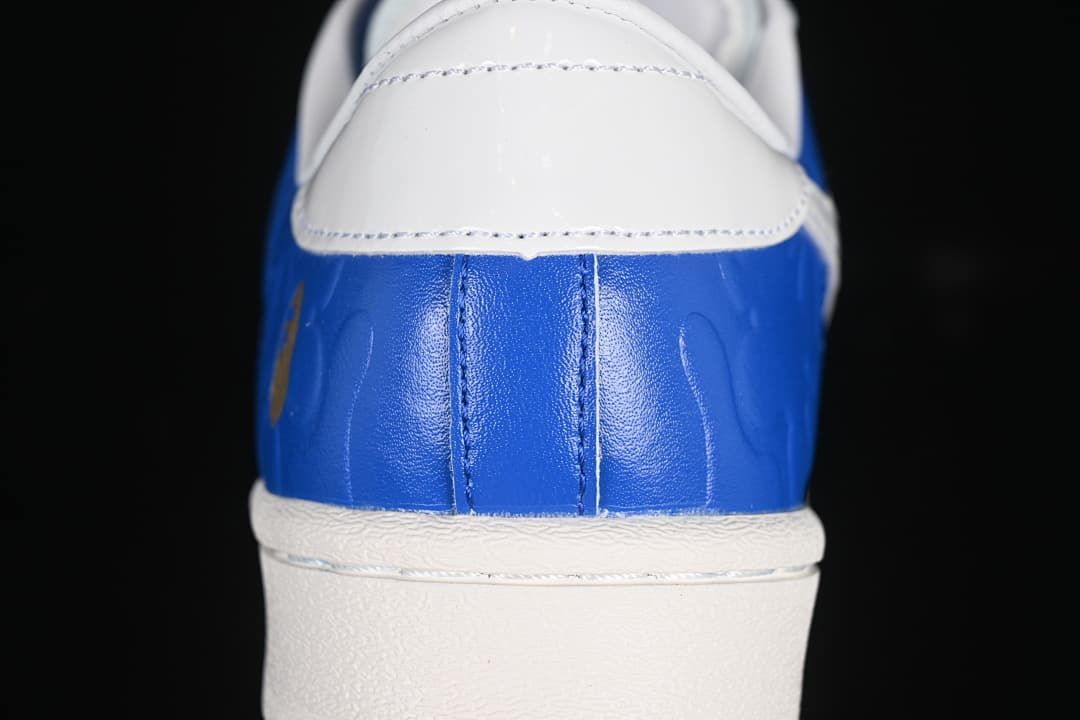 Close-up of blue heel and white heel tab