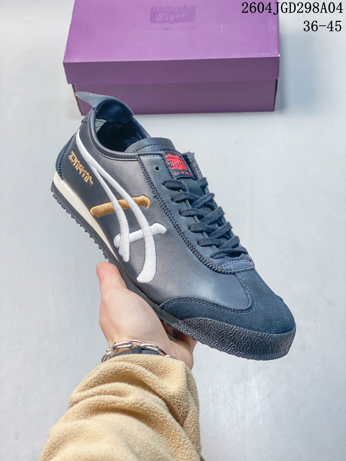 Angled view of a navy Onitsuka Tiger Mexico 66 Deluxe sneaker
