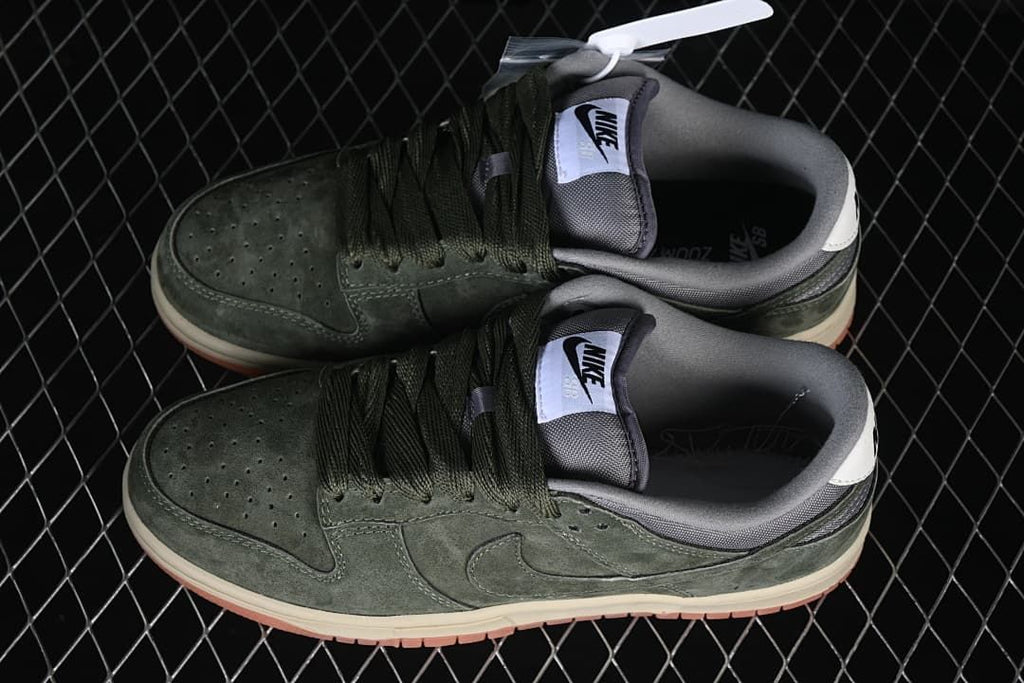 Pair of olive-green Nike SB Dunk Low sneakers viewed from above