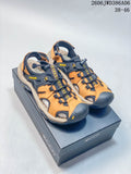 Orange and dark navy ECCO closed-toe outdoor sandals shown from above on a box.