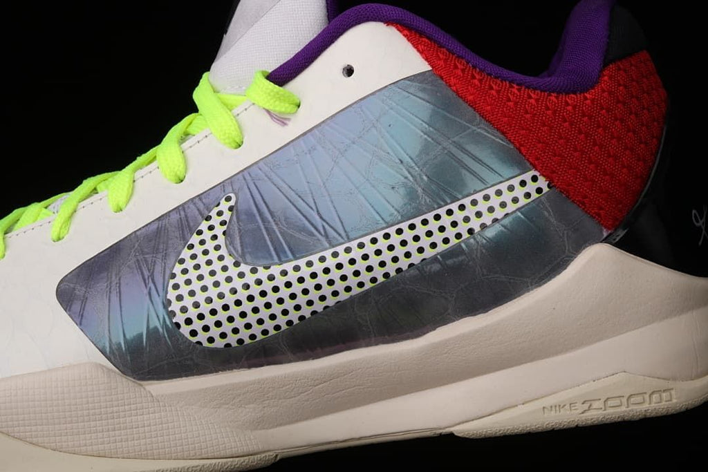 Close-up of the shoe's dotted Swoosh and grey side panel