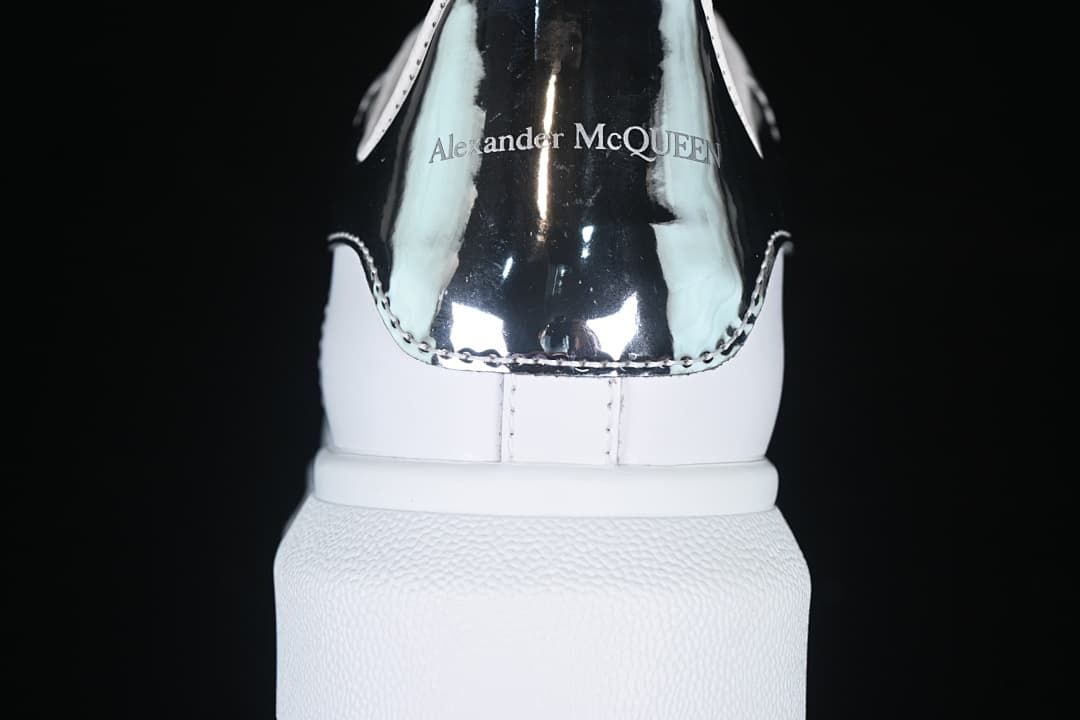 Rear view of the reflective heel panel with Alexander McQueen lettering