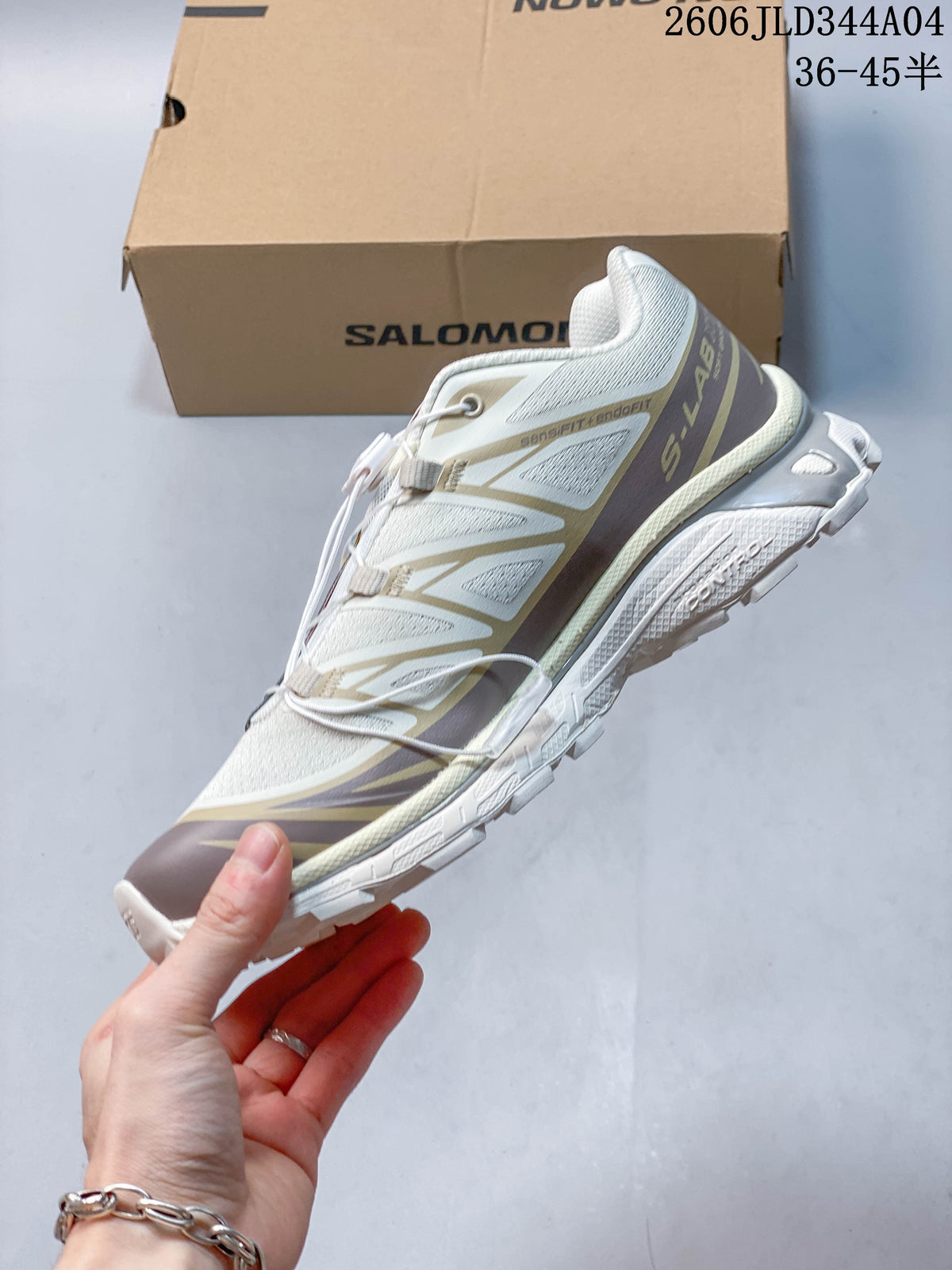 Side view of the white and taupe Salomon XT-6 trail running shoe.