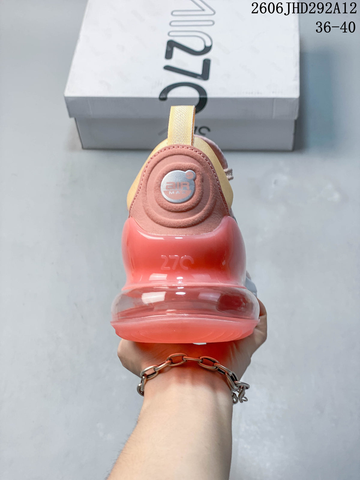 Rear view showing the large coral-colored heel unit on a Nike Air Max 270 shoe