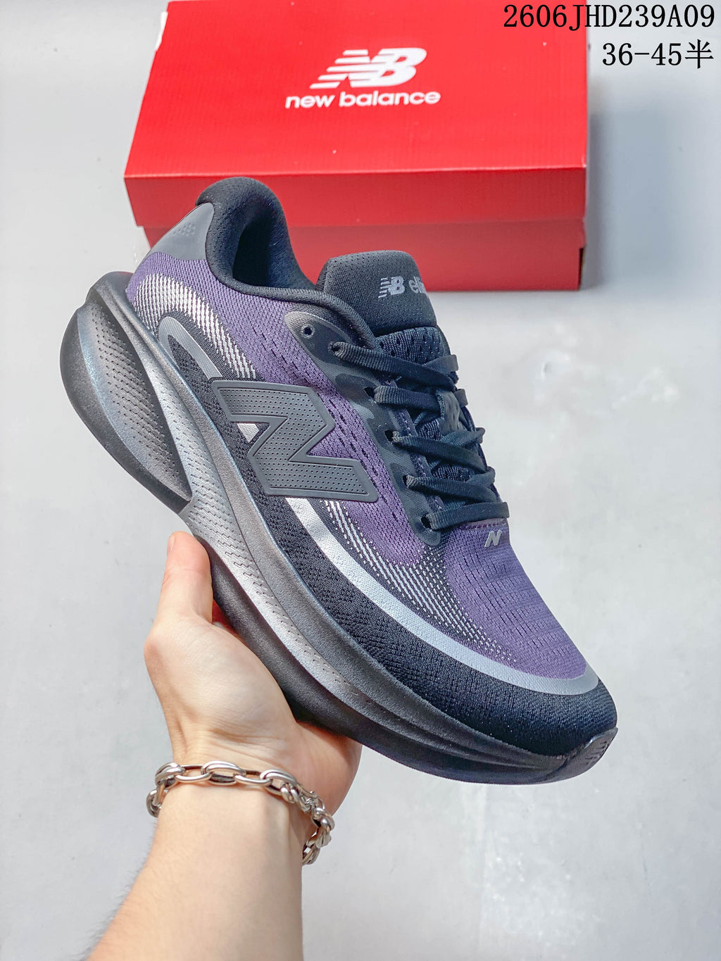 Angled side view of the purple, gray, and dark navy shoe