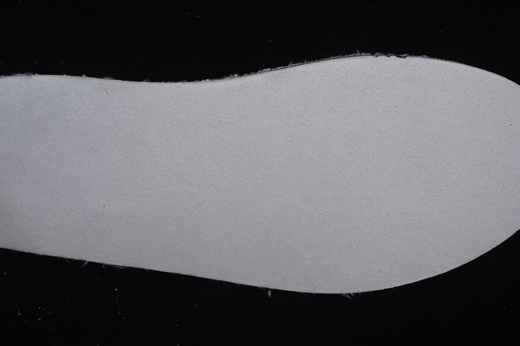 Close-up of the light-colored outsole of the mule slipper.