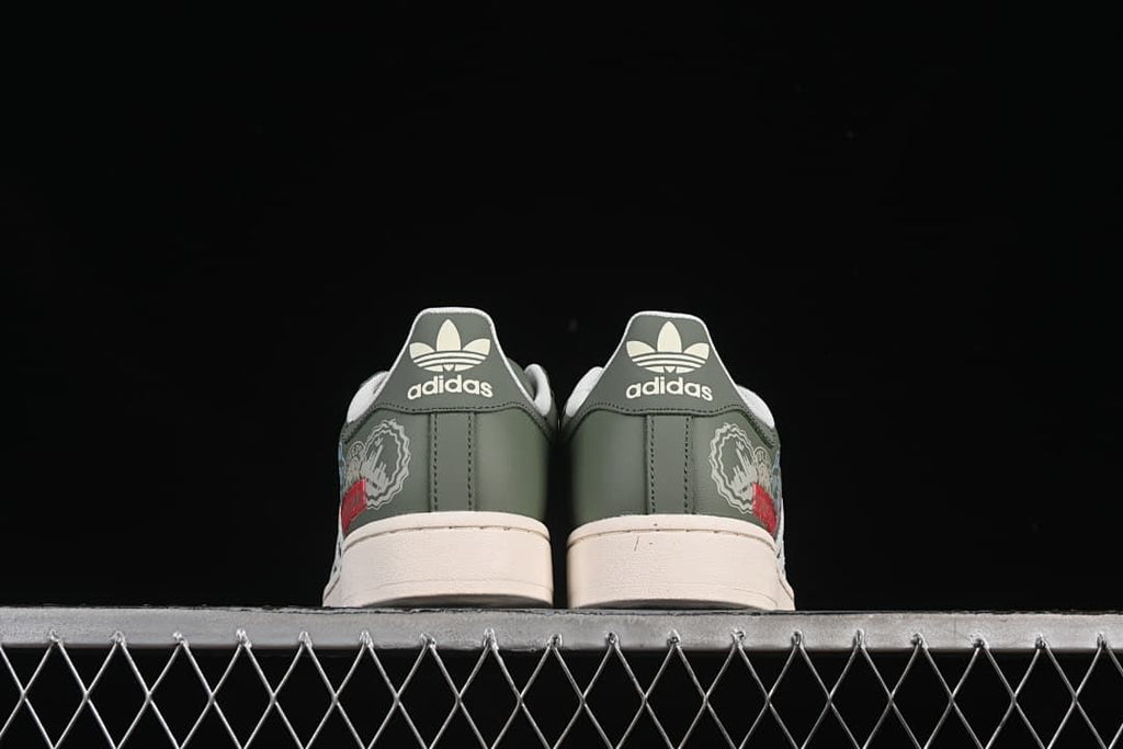 Rear view of the pair with green heel panels and cream soles.