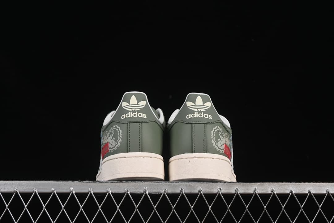 Rear view of the pair with green heel panels and cream soles.