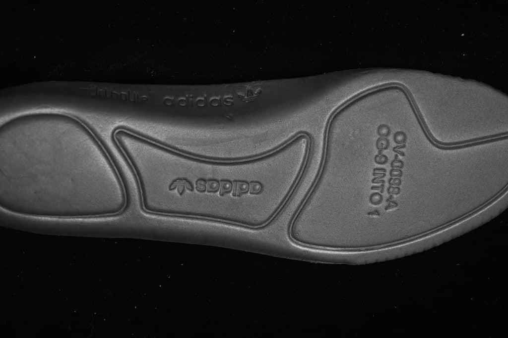 Close-up of the molded outsole with adidas branding