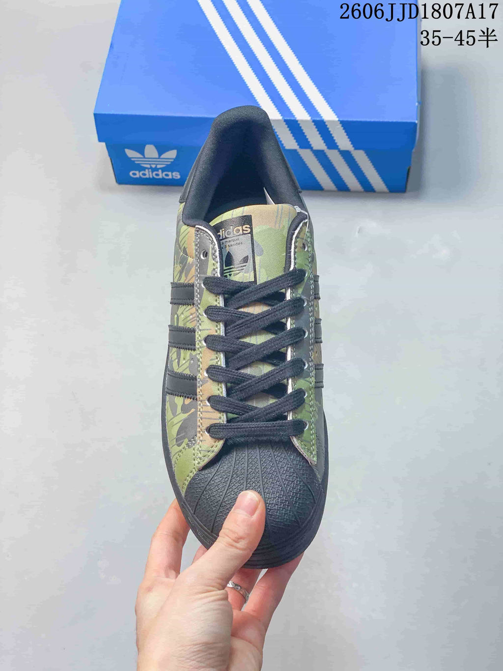 Top view showing black laces and textured shell-style toe