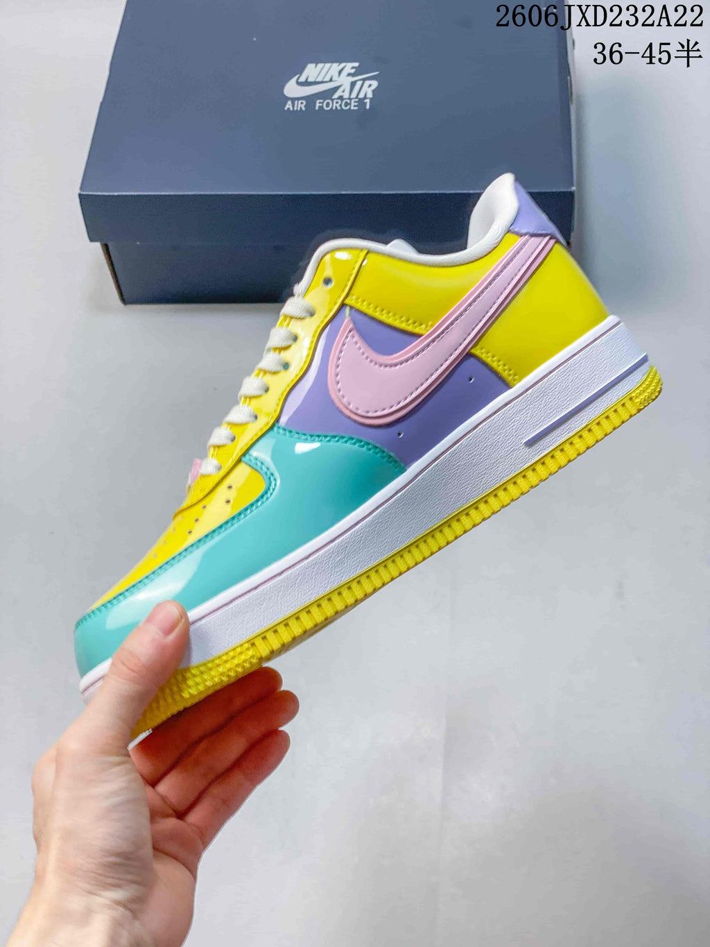 Side view showing yellow, turquoise, lavender, and pink panels