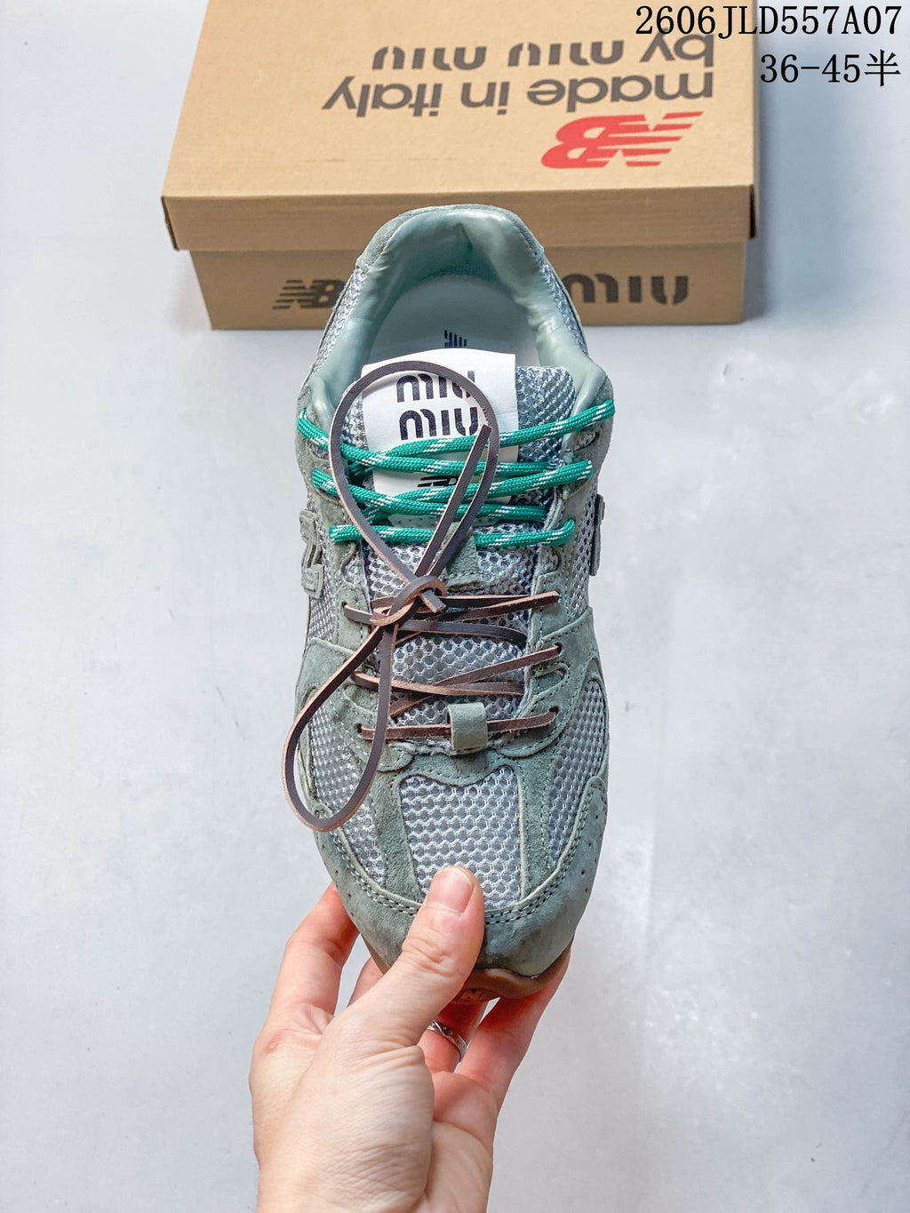 Top view of the sneaker showing its tongue, mesh panels, and multiple lace colors