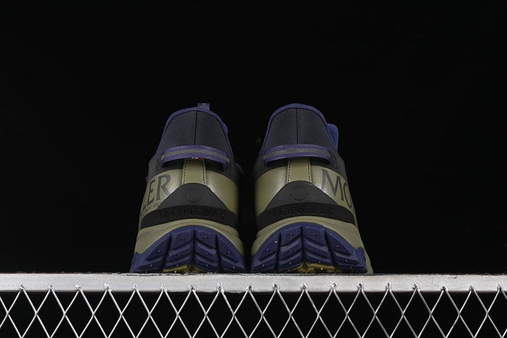 Rear view of the pair showing heel panels and outsole tread