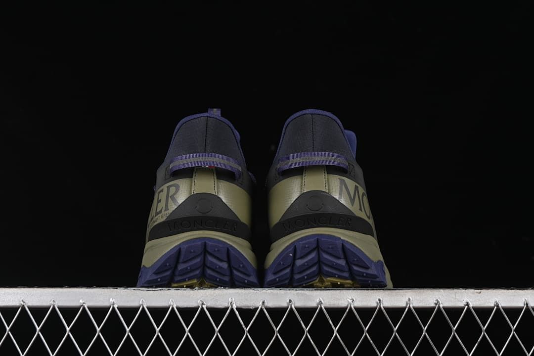 Rear view of the pair showing heel panels and outsole tread