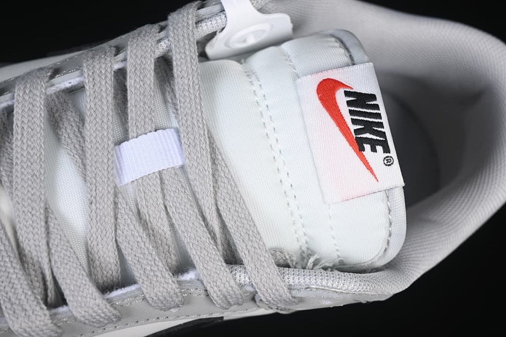 Close-up of the tongue label and grey laces