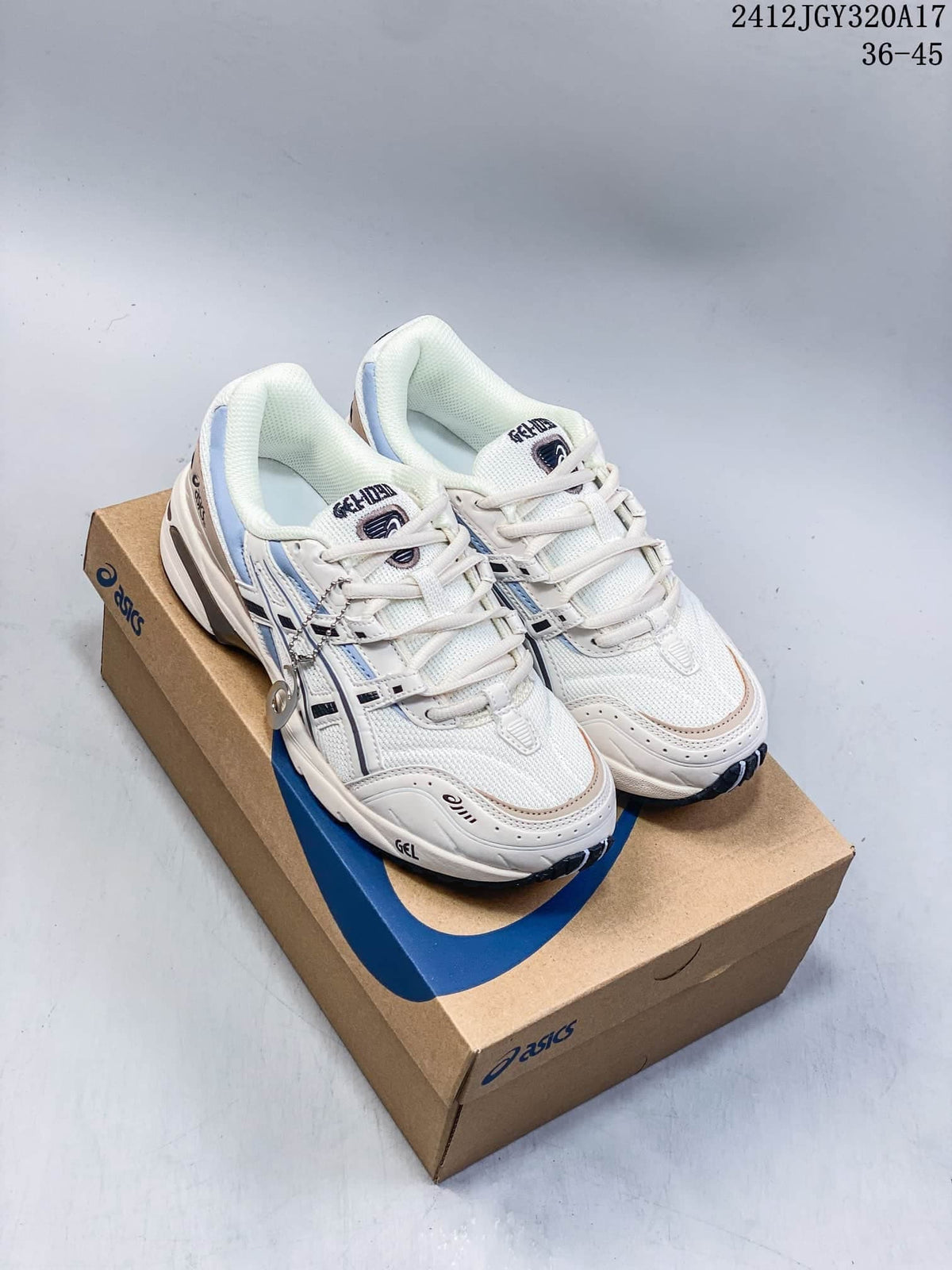 Pair of white and blue ASICS GEL-1090 sneakers on a shoebox; image shows style code 2412JGY320A17 and size range 36–45.