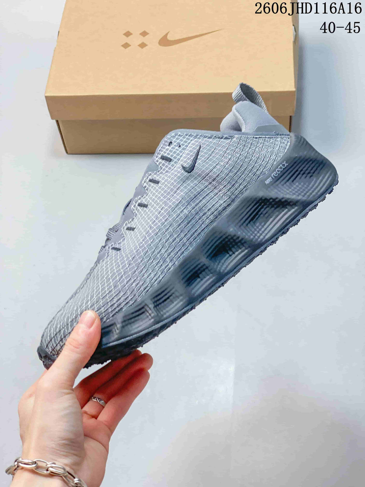 Side view showing the patterned upper and dark sole of a gray Nike Ava Rover Hs shoe