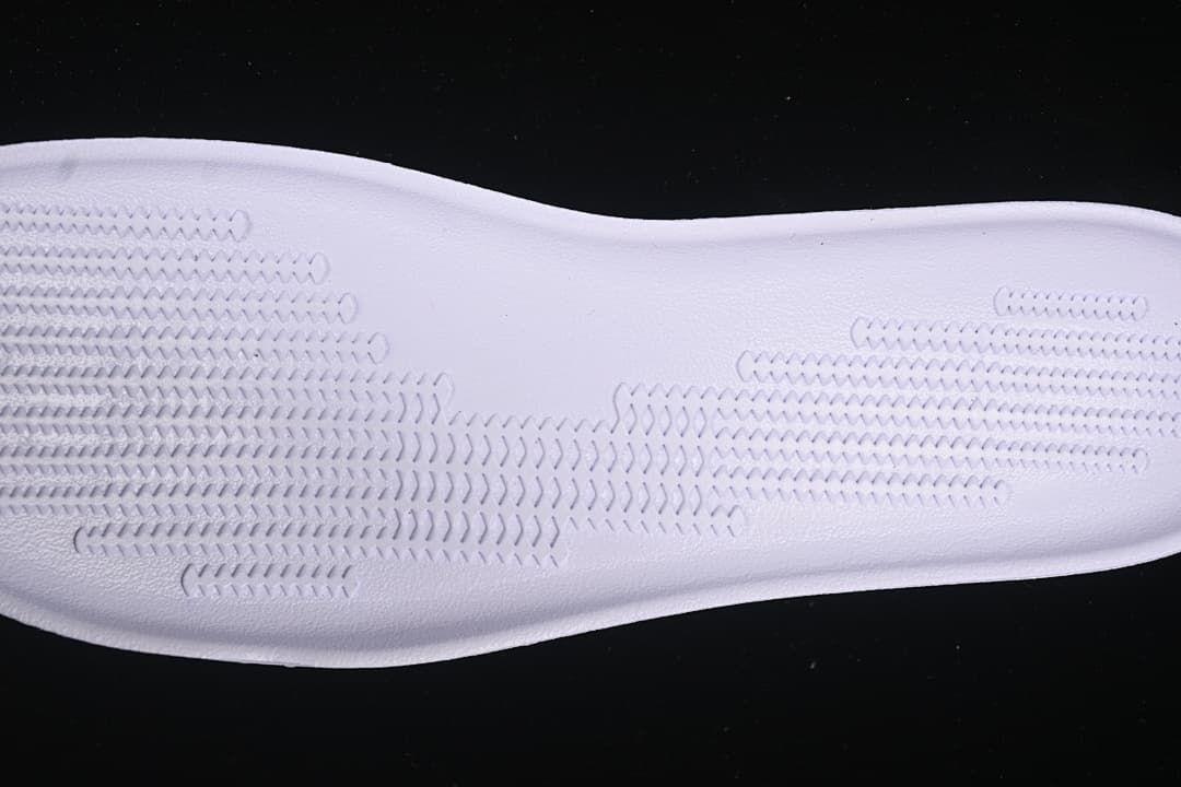 Close-up of the textured tread pattern on a shoe component
