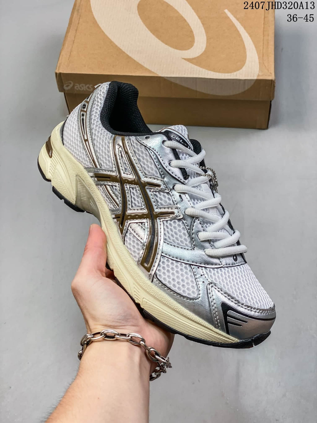 Angled side view of the silver ASICS GEL-1130 sneaker