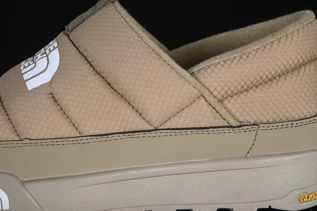 Close-up of quilted khaki upper and side panel