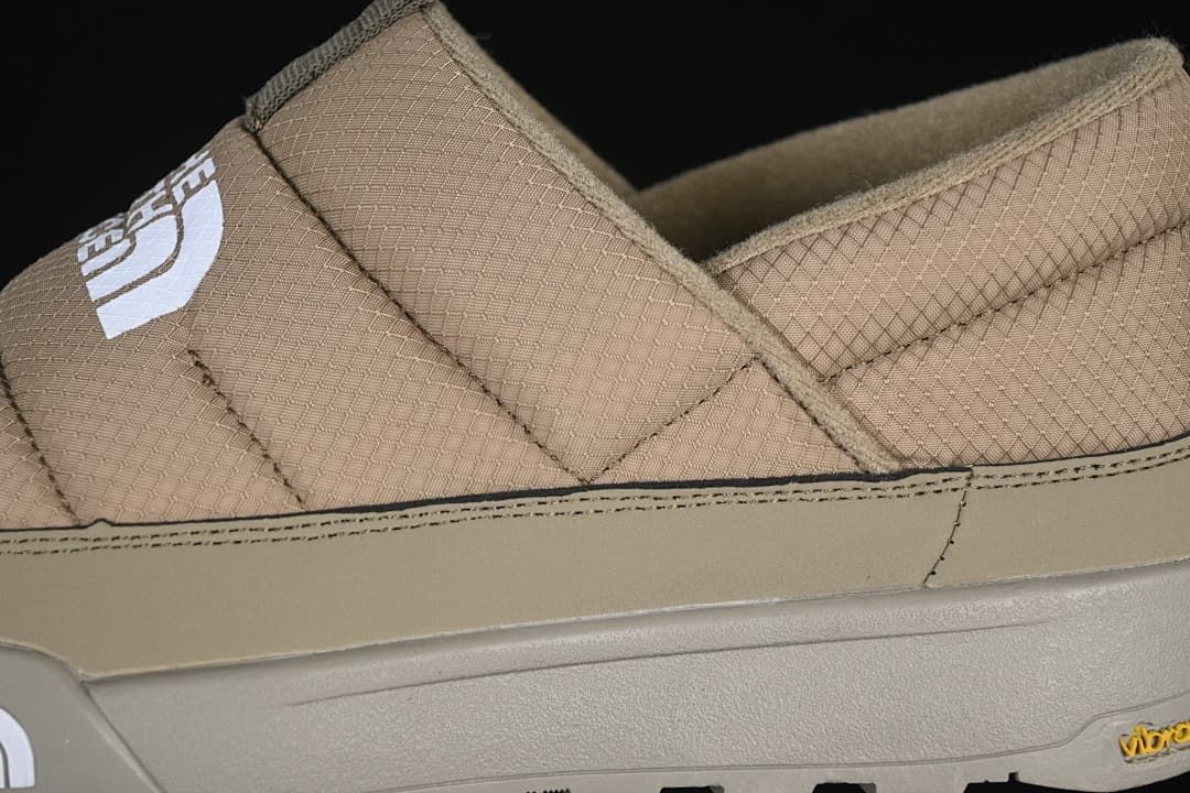 Close-up of quilted khaki upper and side panel